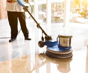people polishes floor indoors